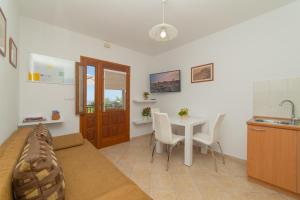 a living room with a couch and a table at Apartments Đivanović in Dubrovnik