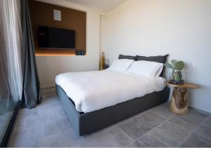 Postel nebo postele na pokoji v ubytování PICCOLA MAESTA' boutique rooms