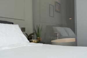 Postel nebo postele na pokoji v ubytování PICCOLA MAESTA' boutique rooms