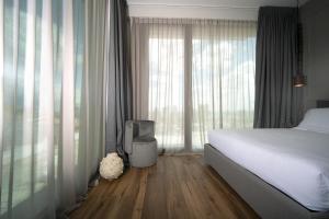 Postel nebo postele na pokoji v ubytování PICCOLA MAESTA' boutique rooms
