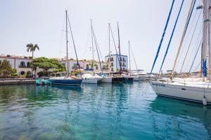a group of boats docked in a marina at Hotel LIVVO Puerto de Mogán in Puerto de Mogán