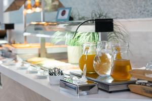 a counter with several jars of honey on it at Hotel LIVVO Puerto de Mogán in Puerto de Mogán