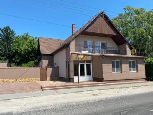 a house on the side of a street at Fanni Vendégház in Balatonboglár