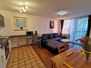 a living room with a couch and a table at 7 Heaven in Eichenberg