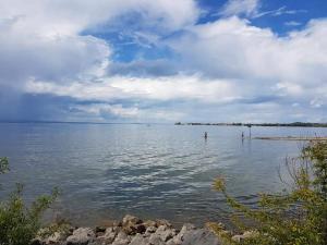 a large body of water under a cloudy sky at 7 Heaven in Eichenberg