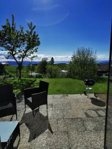 a patio with a table and chairs and a grill at 7 Heaven in Eichenberg
