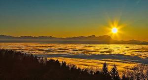 a view of the sun rising above the clouds at 7 Heaven in Eichenberg