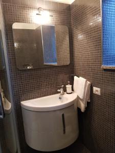 a bathroom with a sink and a mirror at Casa Nonna Anna in Maiori