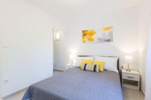 Postel nebo postele na pokoji v ubytování Petra modern apartment with free parking and BBQ