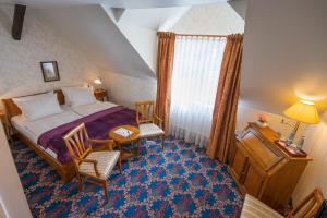 Postel nebo postele na pokoji v ubytování Boutiquehotel Schloßpalais + 37 fotografií