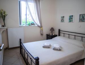 Ένα ή περισσότερα κρεβάτια σε δωμάτιο στο Helen - The Spartan Home