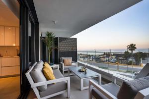 a living room with a view of the ocean at Sealine luxury apartment in Torrox Costa in Torrox Costa