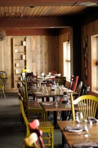 
a dining room filled with tables and chairs at Sugarloaf in Carrabassett
