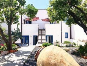 a building with a large object in front of it at Punta Sallustro Lipari in Lipari +38 photos