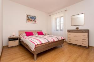 Ein Bett oder Betten in einem Zimmer der Unterkunft Apartment Mira Šilo-Krk