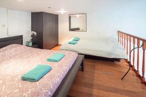 Ένα ή περισσότερα κρεβάτια σε δωμάτιο στο Saint Paulus Square Apartments