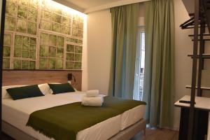 a bedroom with a bed and a large window at Casp Green House in Barcelona