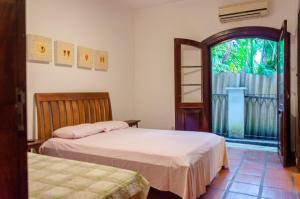 מיטה או מיטות בחדר ב-Beer Hostel Suites Privativas e Compartilhadas