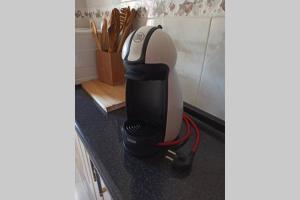 a hair dryer on a counter in a kitchen at Apartamento La Parra in Arenas de San Pedro +9 photos