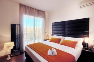 Postel nebo postele na pokoji v ubytování D-Place Hotel & Suite