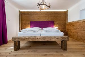 Posteľ alebo postele v izbe v ubytovaní SportRedia Appartements