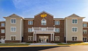 a large brick building with a cpt sign on it at stayAPT Suites Alexandria-Fort Belvoir in Alexandria