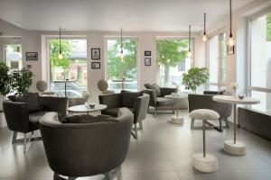 Area soggiorno di Thomas Albert Hotel