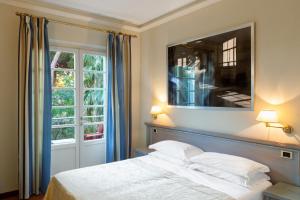 Postel nebo postele na pokoji v ubytování Hotel Mignon