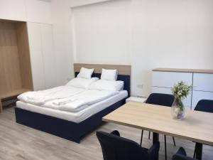 Postel nebo postele na pokoji v ubytování Bagolyvár Fogadó- Újfalusy Márton Vendégház