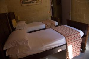 Postel nebo postele na pokoji v ubytování B&B Malennio