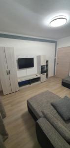 a large living room with a flat screen tv at Apartments Miklus in Portorož