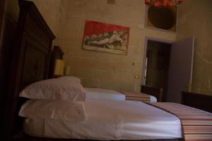 Postel nebo postele na pokoji v ubytování B&B Malennio