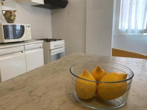 a bowl of oranges sitting on a kitchen counter at Marie Claire in Levanto
