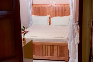 Postel nebo postele na pokoji v ubytování Botanika Hotel