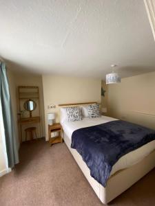 Postel nebo postele na pokoji v ubytování Delightful 3 bedroomed cottage in Llandudno