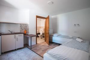 Postel nebo postele na pokoji v ubytování Natúra Panzió&Apartmanház