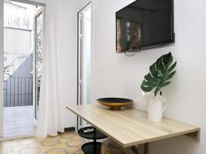 TV a/nebo společenská místnost v ubytování Casa nanit apt c