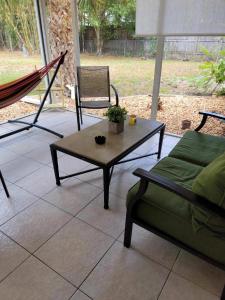 a living room with a couch and a coffee table at Hidden quiet gem close to everything!!! in Sarasota