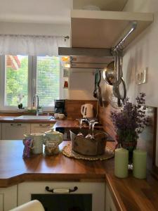 a kitchen with a sink and a counter top at Villa Dora - Mediterranean family house for 9 with private garden, BBQ, sea view and private parking for 4 cars in Pag +34 photos