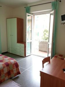 Ένα ή περισσότερα κρεβάτια σε δωμάτιο στο Hotel Mignon Posta