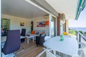 a room with a balcony with a table and chairs at Apartment Llavaneres II in Sant Andreu de Llavaneres