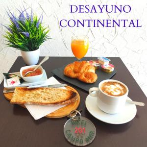 a table with a tray of food and a cup of coffee at Hotel Restaurante Campomar in Cartagena +25 photos