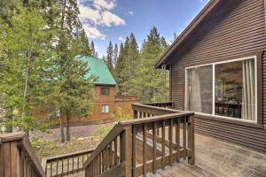a balcony with a wooden railing and a house at Modern Mountain Chalet Near Donner Lake! in Truckee