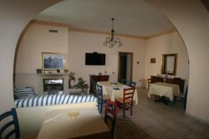 a living room with a couch and a table at Tavernola - Locanda Di Campagna in Battipaglia