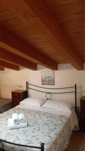 Katil atau katil-katil dalam bilik di Alloggio Turistico L'Ulivo