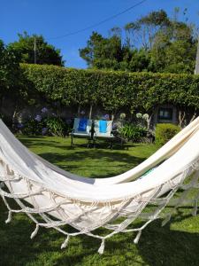 a hammock in the yard of a house at Cantinho da Luz in Ponta Delgada