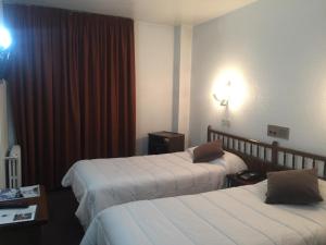 Postel nebo postele na pokoji v ubytování Hotel Folch
