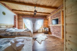 Postel nebo postele na pokoji v ubytování "Podhalański Domek"-250m Gorący Potok, Termy Szaflary