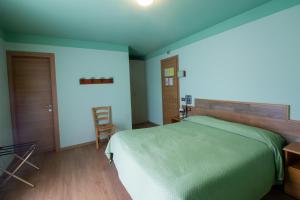Un pat sau paturi într-o cameră la Albergo Speranza