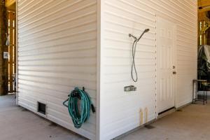 a shower in the side of a building at Turtles Nest in Dauphin Island